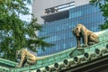 Onigawara (Ogre goblin tile) gargoyle style roof ornaments at Taiseidan main hall of Yushima Seido Temple. Royalty Free Stock Photo