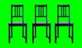 four black chairs with a green screen background