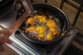 Onion bajji, deep fried onion bhajis in a home kitchen