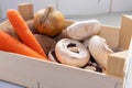 Onion Carrots Mushrooms and Potates in Wooden Box