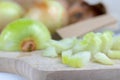 Onion on a chopping board on a white kitchen table. Vegetables f Royalty Free Stock Photo