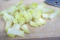 Onion on a chopping board on a white kitchen table. Vegetables f Royalty Free Stock Photo