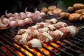 onion chunks and beer foams on grilling sausages