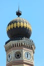 Onion dome on an octagonal tower with clocks at the top of the Dohany Street Synagogue