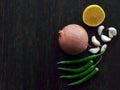 Onion, garlic, green chillies and lemon on wood table. Royalty Free Stock Photo
