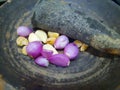 Onion and garlic in a pestle and stone mortar Royalty Free Stock Photo