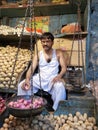 Onion and potato seller in Dadar vegetable market, Mumbai