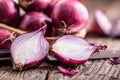 Onion. Red onions on very old oak wood board Royalty Free Stock Photo