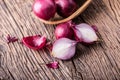 Onion. Red onions on very old oak wood board Royalty Free Stock Photo