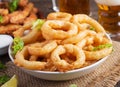 Onion rings in batter with sauce and cheese sticks. Beer snacks. Royalty Free Stock Photo