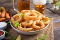 Onion rings in batter with sauce and cheese sticks. Beer snacks. Royalty Free Stock Photo