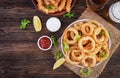 Onion rings in batter with sauce and cheese sticks. Beer snacks. Royalty Free Stock Photo