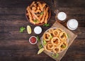 Onion rings in batter with sauce and cheese sticks. Beer snacks.