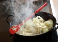 Onion rings frying in a hot pan Royalty Free Stock Photo