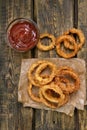 Onion rings with tomato sauce, top view Royalty Free Stock Photo