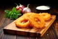 onion rings on a wooden chopping board