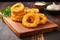 onion rings on a wooden chopping board