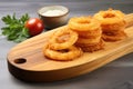 onion rings on a wooden chopping board