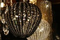 Onion shaped dark coloured basket crystal chandelier by manufacturer Bohemia Crystal Chandeliers hanged in booth on Furniture Expo