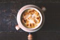 Onion soup in the ceramic pot on the wooden table top view Royalty Free Stock Photo