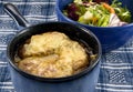 Onion Soup and Salad on Blue Cloth Royalty Free Stock Photo