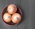 Onion in wooden bowl Royalty Free Stock Photo