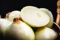 Onions black background, onion cut in half, spot focus, culinary ingredient Royalty Free Stock Photo