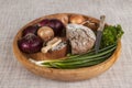 Onions, brown bread wooden tray with parsley and salt and celery ,knife Royalty Free Stock Photo