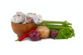 Onions, chili pepper and garlic bulbs in wooden bowl