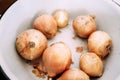 Onions in an enameled bowl