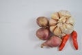 Onions, garlic and chilies  on white background. Royalty Free Stock Photo