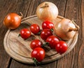 Onions napiform tomatoes on an old table Royalty Free Stock Photo