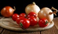 Onions napiform tomatoes on an rural table Royalty Free Stock Photo