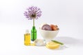 Onions, oil, cream, lemon, Aloe vera and Allium giganteum flower on white background
