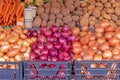 Onions and potatoes piles on market