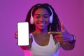 Online Ad. Happy Black Female Pointing At Blank Smartphone With White Screen Royalty Free Stock Photo