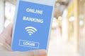 Online banking login app on mobile phone, Hand using smartphone with digital bank account password sign in on screen device over Royalty Free Stock Photo