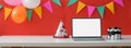 Online Birthday celebration concept with blank screen laptop, party hat and copy space