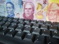 online business, approach to mexican banknotes and computer keypad