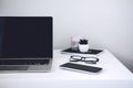 Online business ideas. Starting Small Business Online. Modern workspace with blank screen laptop, cell phone, pencil, on