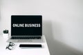 Online business ideas. Starting Small Business Online. Modern workspace with Online business text on screen laptop, cell