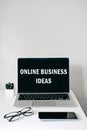 Online business ideas. Starting Small Business Online. Modern workspace with Online business text on screen laptop, cell