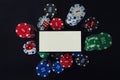 Online casino gambling concept. Smartphone blank screen on chips stack and playing dice. People entertainment, play mobile phone Royalty Free Stock Photo