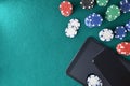 Online casino games with mobile devices on mat with objects Royalty Free Stock Photo