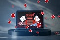 Online casino and gaming, gambling on device concept. Close up of laptop computer on pedestal with creative slot machine and other Royalty Free Stock Photo