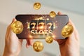 Online casino, smartphone with slot machine with jackpot and gold coins. Online Slots, Lucky Seven 777, Dark Gold Style. Luck Royalty Free Stock Photo