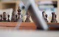 Online chess. Wooden pieces on a chessboards. Play Chess Online for all levels. From the cancellation of over the board chess by l