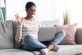 Online Communication. Cheerful Black Woman Using Laptop For Video Call At Home Royalty Free Stock Photo