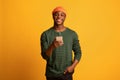 Online Communication. Cheerful young black man holding smartphone and smiling at camera Royalty Free Stock Photo