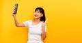 communication concept online learning Asian girl portrait cute happy in white dress talking on mobile phone and laughing on Royalty Free Stock Photo